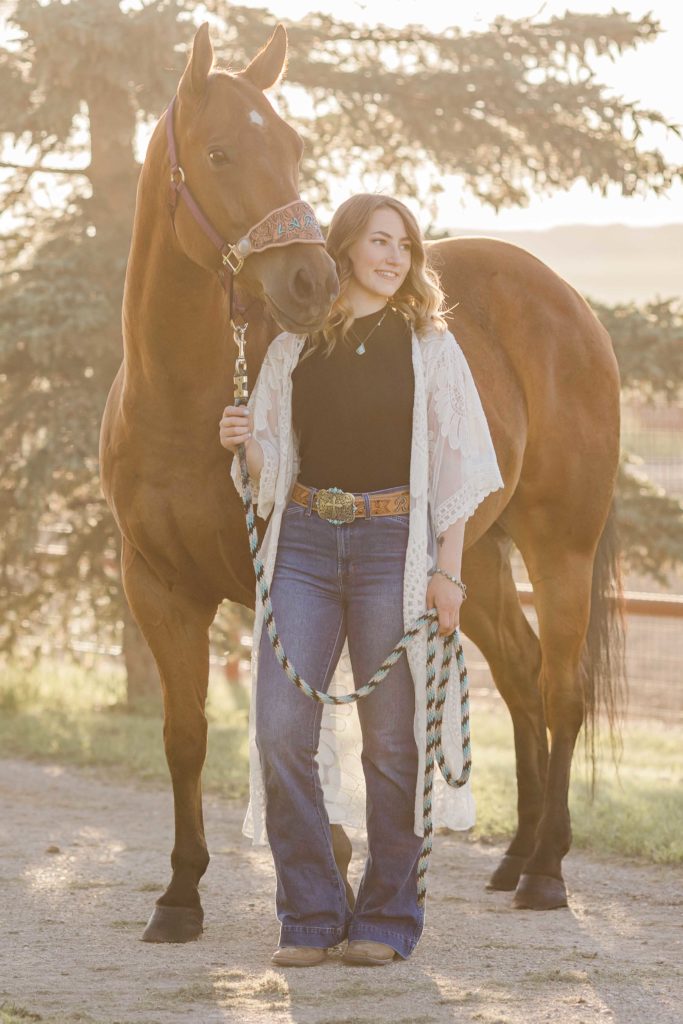 western cowgirl with bay horse
