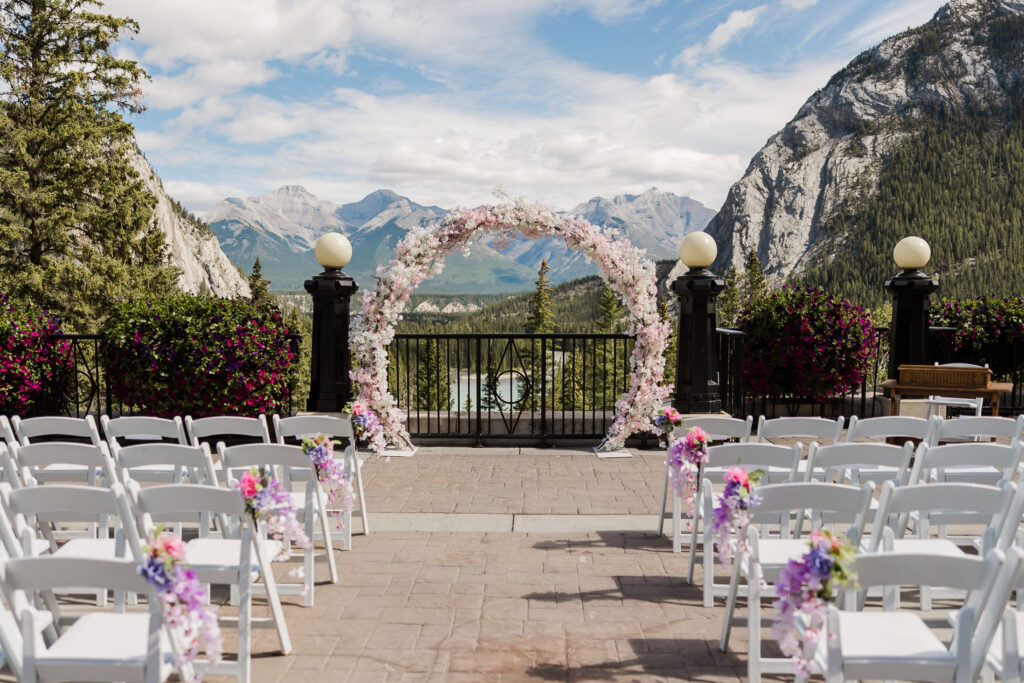 banff wedding with floral arch and mountain views at the Banff Springs